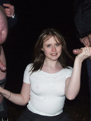 Girl posing with two cocks before sucking them