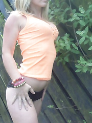 shy girl whowing her tits in the garden