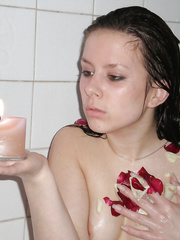 Return of tiny brunette hair who takes a bathroom with flowers