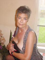 This Babe positions for the camera with a hat and a smile