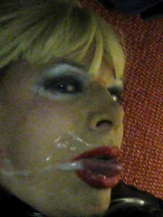 PatsyPVC Sissy Cock Sucking Fetish Slut Transvestite Dressed in a Womens Shiny PVC Dress, Shiny PVC Suspender belt, Stockings, High Heels and just sucked off a cock and got cum all over my face