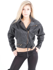 Golden-Haired sweetheart unzips her leather jacket in a dark brassiere and leggings