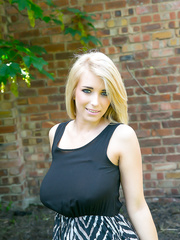 Breasty blond Jodie takes off her clothing outdoors to sun her saggy scones