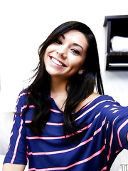 Smiley non-professional sweetie making selfies and revealing her bald cooter