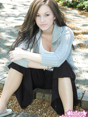 Dilettante model disrobes down to a dark belt in her driveway