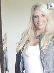 Platinum blond gal Tasha Reign taking selfies during the time that getting in nature's garb