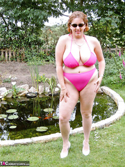 Brazen aged fatty Curvy Claire sheds bikini in the backyard to finger fuck