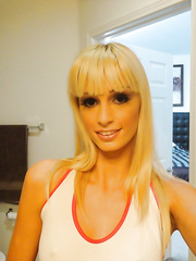 Golden-Haired playgirl Erica Fontes taking selfies in mirror whilst taking off her clothing