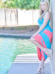 Golden-Haired 1st timer lifts up her lengthy suit to masturbate by the pool