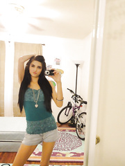 Slim female Zoey Kush ditching her shorts and top whilst taking selfies