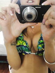 Sexy hottie Capri Cavanni takes self shots exposing large mambos and body in bikini