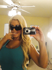 Sultry Lalin Girl babe Bridgette B stripping during self shots in mirror