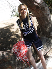 Slim golden-haired cheerleader Kennedy Kressler gives it up to a giant dark knob