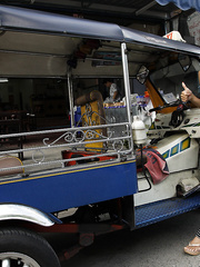 Nice-Looking Thai female slips pink pants over her butt to pose exposed