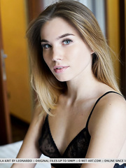 Admirable legal age teenager gal Lola Krit remover her dark brassiere to model in the stripped