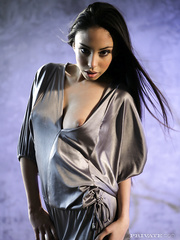 Exotic girl Alexis Love slides off a silk robe and strap for exposed positions