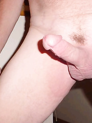 Hubby naked, showing off his hard cock, doing what he loves