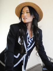 Oriental schoolgirl Ayumi Natsume undresses off her uniform on teacher's desk