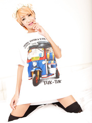 Oriental angel Omsin positions for the camera in a shirt and knee socks