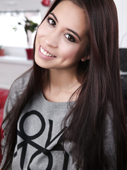 Oriental gal Paula Shy works a sex toy into her juicy muff on her sofa