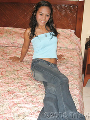 Non-Professional Oriental legal age teenager positions in taut jeans and strips to give a nude oral sex