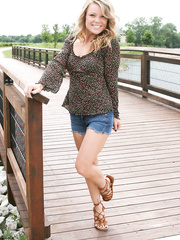 Dilettante hottie slips her jean shorts over her strap overspread along water's edge