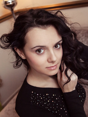 Sexy brunette hair legal age teenager takes off her suit and pants to model in the bare