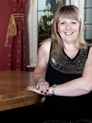 Older mamma in dark nylons climbs on the dining table to widen wide open