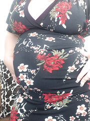 Preggy redhead Georgia Peach takes her suit off and positions nude on the ottoman