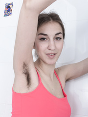 Naughty gal Halmia gladly shows off her puffy nipps and a furry pussy