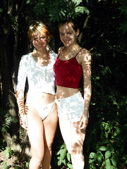 Smiles besties flash hawt arse outdoors and play bare in the shower jointly