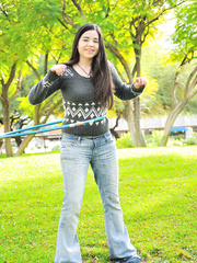 Fat brunette hair takes off all her clothing in public during the time that working a hula hoop