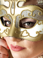 Blonde big beautiful woman Bailey Santanna removes her masquerade mask in advance of baring her juggs