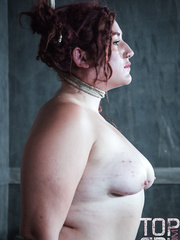 Overweight playgirl undergoes extraordinary punishment session and bruising in a dungeon