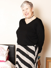 Thick grandmother from the UK squeezes her milk sacks jointly whilst disrobing