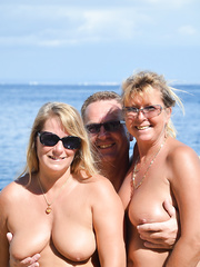 2 blond babes with saggy bazookas have a fun hawt engulf and fuck in beach trio