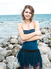 Legal Age Teenager angel discloses her large natural pantoons and shaved slit on oceanside rocks