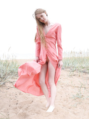 Wild juvenile legal age teenager Gerda lounging half bare at the beach showing very miniature scoops