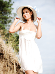 Beach sweetheart Suzanna A in costume with legs wide open flaunting her shaved wet crack