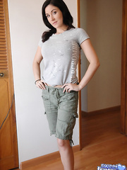 Nice-Looking brunette hair Krissy in shorts removing her brassiere to caress her large tits