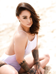 Hawt Euro model Mica Martinez displays her incredible inked body at the beach