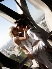 Stocking clad Tasha Reign displaying large marangos whilst receiving oral stimulation and anal