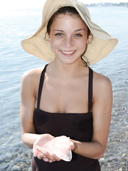 Barley legal legal age teenager takes off her clothing to positions bare on an air mattress