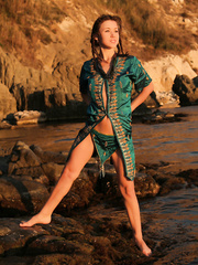 Hawt Firebird A positions stripped breasted on the beach rocks like an erotic mermaid