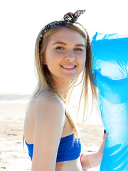 Juvenile golden-haired Nimfa shes her shorts at the beach to widen bare in the sun