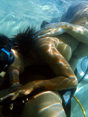 Oriental scuba diver gives a BJ underwater previous to fucking beside pool