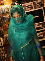 Indian female Nadia Ali sucks off a large darksome pecker thru a brilliance gap