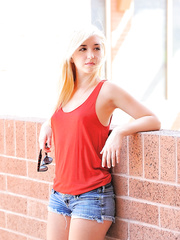 Hot dressed beauty in shorts and pigtails undressing and pissing outdoors