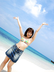 Japanese legal age teenager Chikaho Ito models non undressed at the beach in a bikini