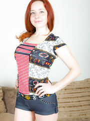 Hot redhead Sara Nikol on her knees letting her large saggy pointer sisters hang down